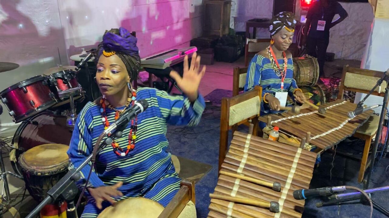 Fatoumata Djeliguinet Kouyaté and Mariama Kouyaté playing balafon and djembe