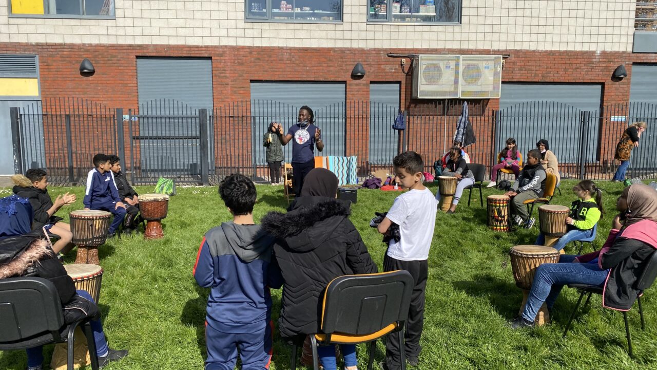 African drumming workshop in Canal Park, Butetown