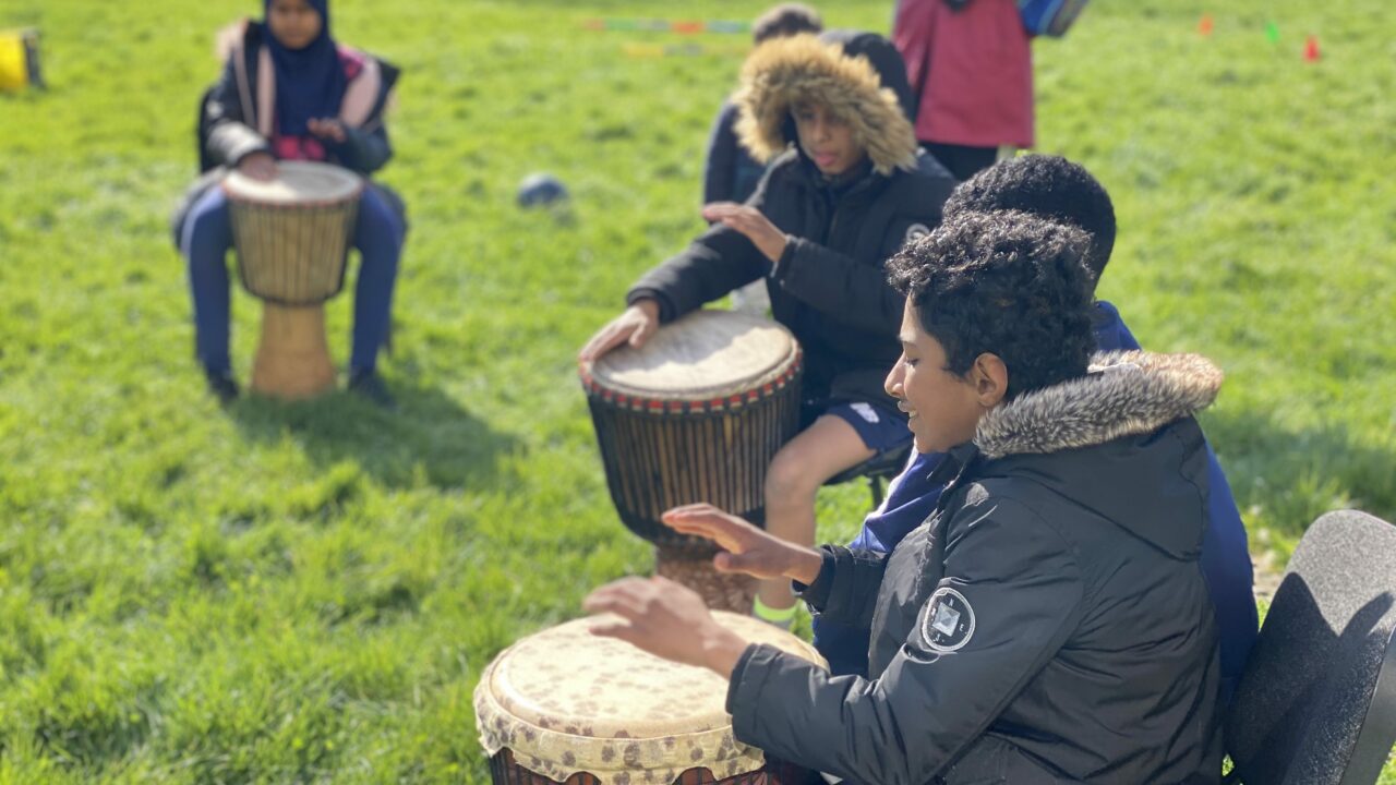 African drumming workshop in Canal Park, Butetown