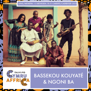 Bassekou Kouyate & Ngoni Ba holding Malian instrument the ngoni (lute)