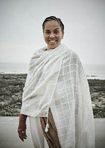 Ofelia wearing white shawl with Porthcawl seafront in the background