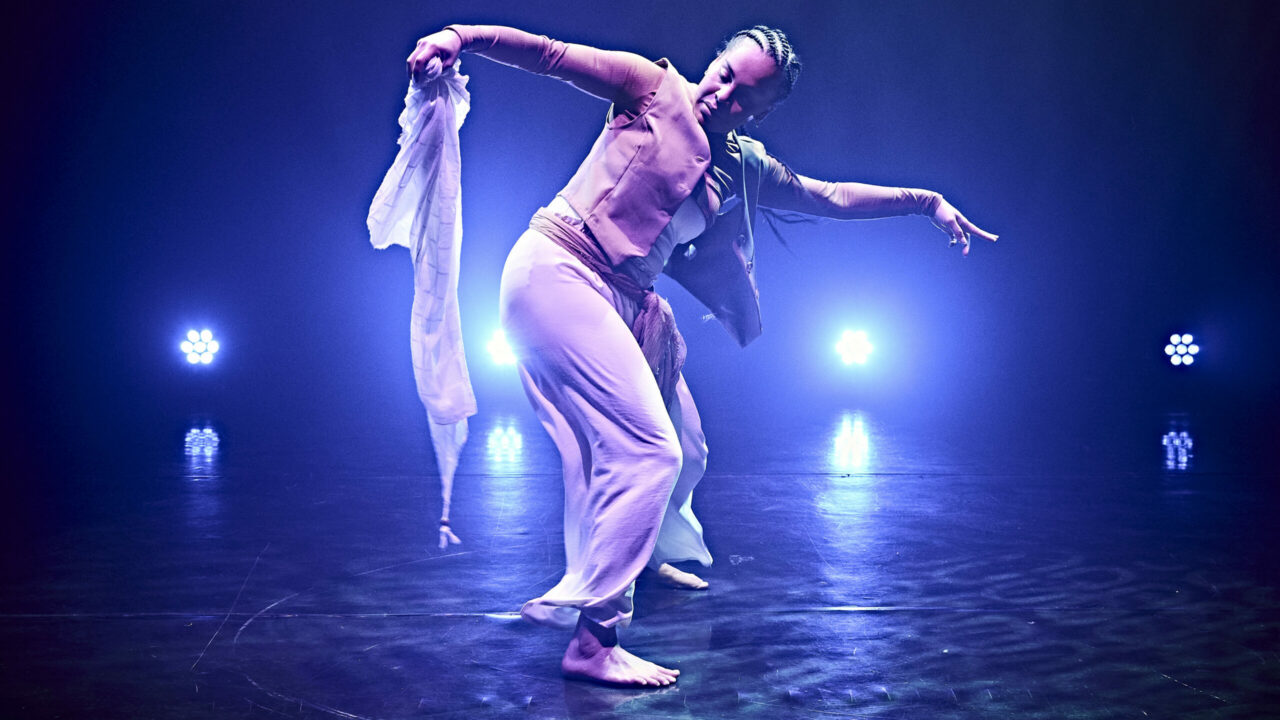 Ofelia Balogun dancing on stage at Porthcawl Pavillion